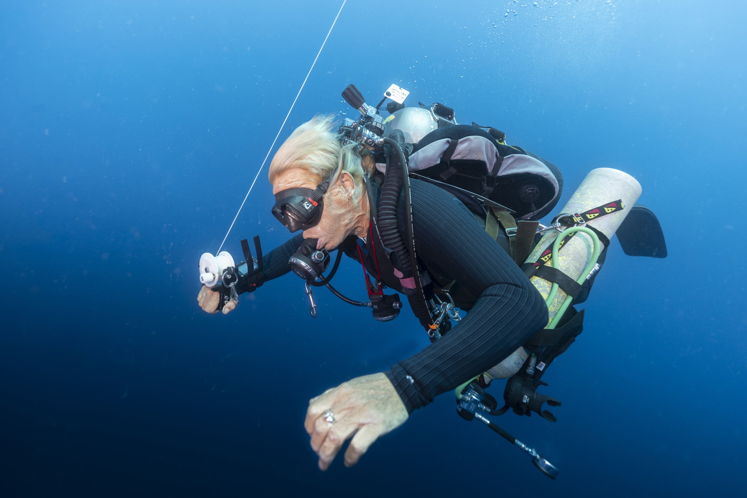  University if the Virgin Islands technical diver Shaun Kadison descends through the open blue space to 150 feet underwater. 