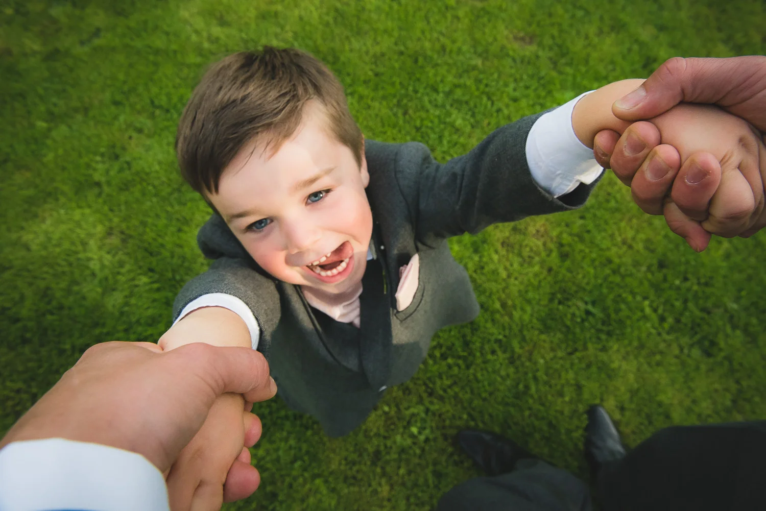 creative wedding photograph of child at wedding playing games