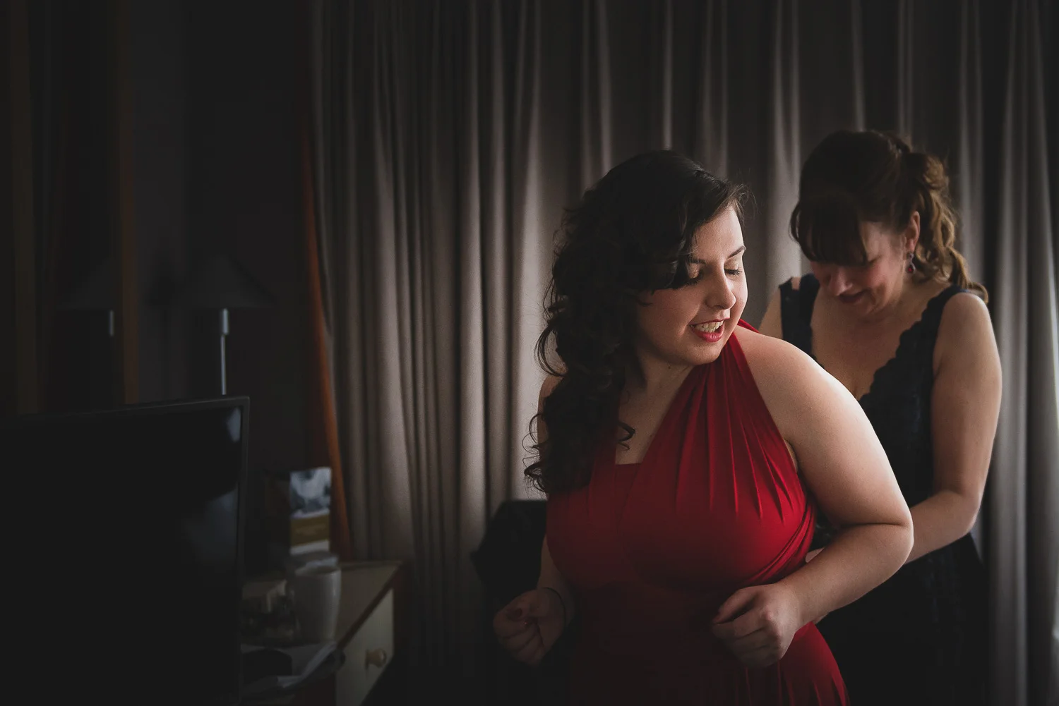bride getting dressed for her wedding in bristol