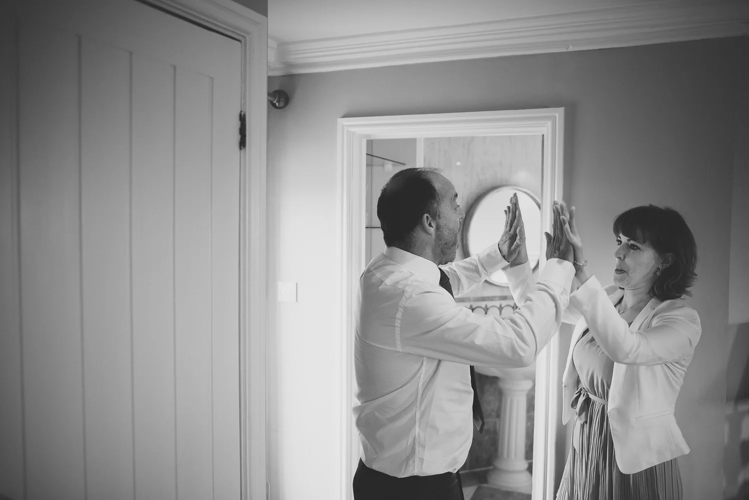 documentary wedding moment of father of the bride high five daughter