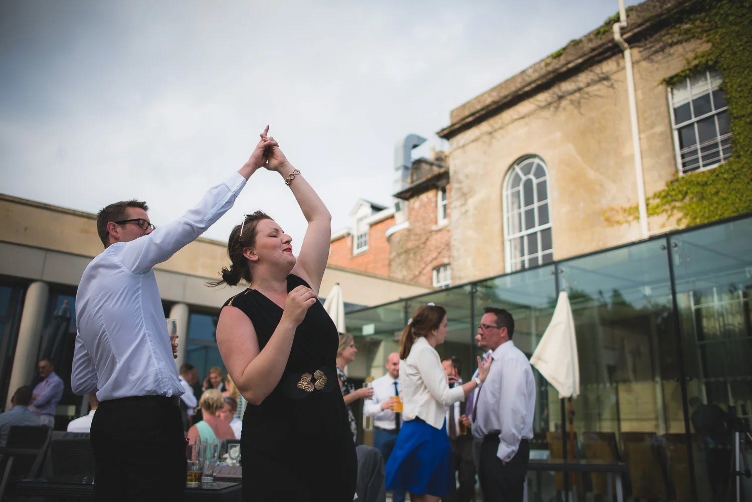 wedding guest dancing to music outdoor reception