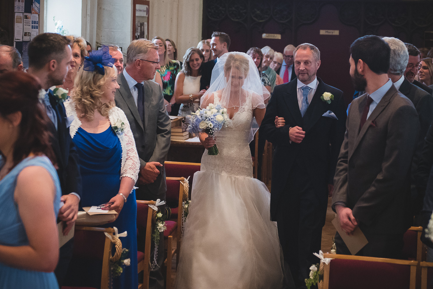 emotional bride walking down st peter's chruch in portishead