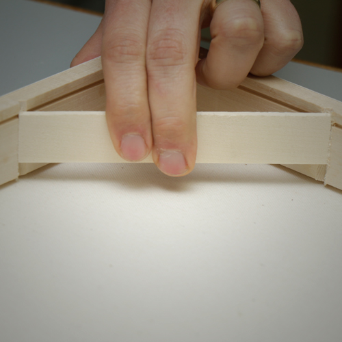 Tabs easily snap into place to provide constant tension that creates a drumlike feel to the canvas