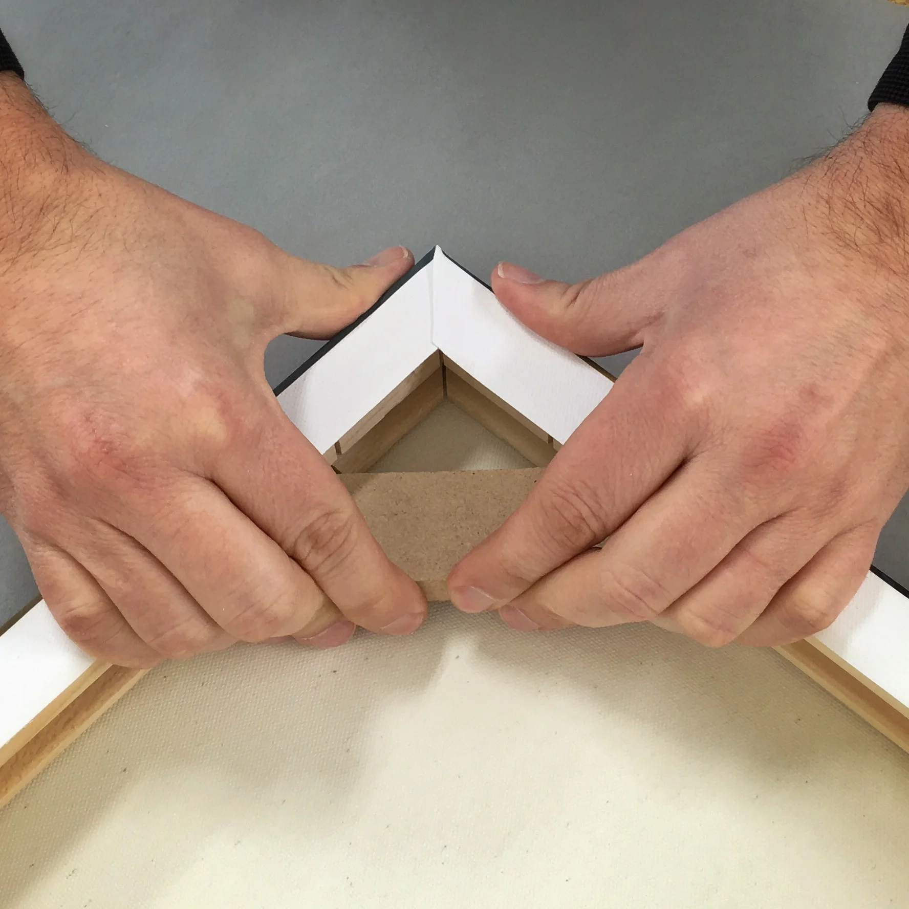 Tensioners easily fit into place to allow for more tension that produces a drumlike feel to the canvas.