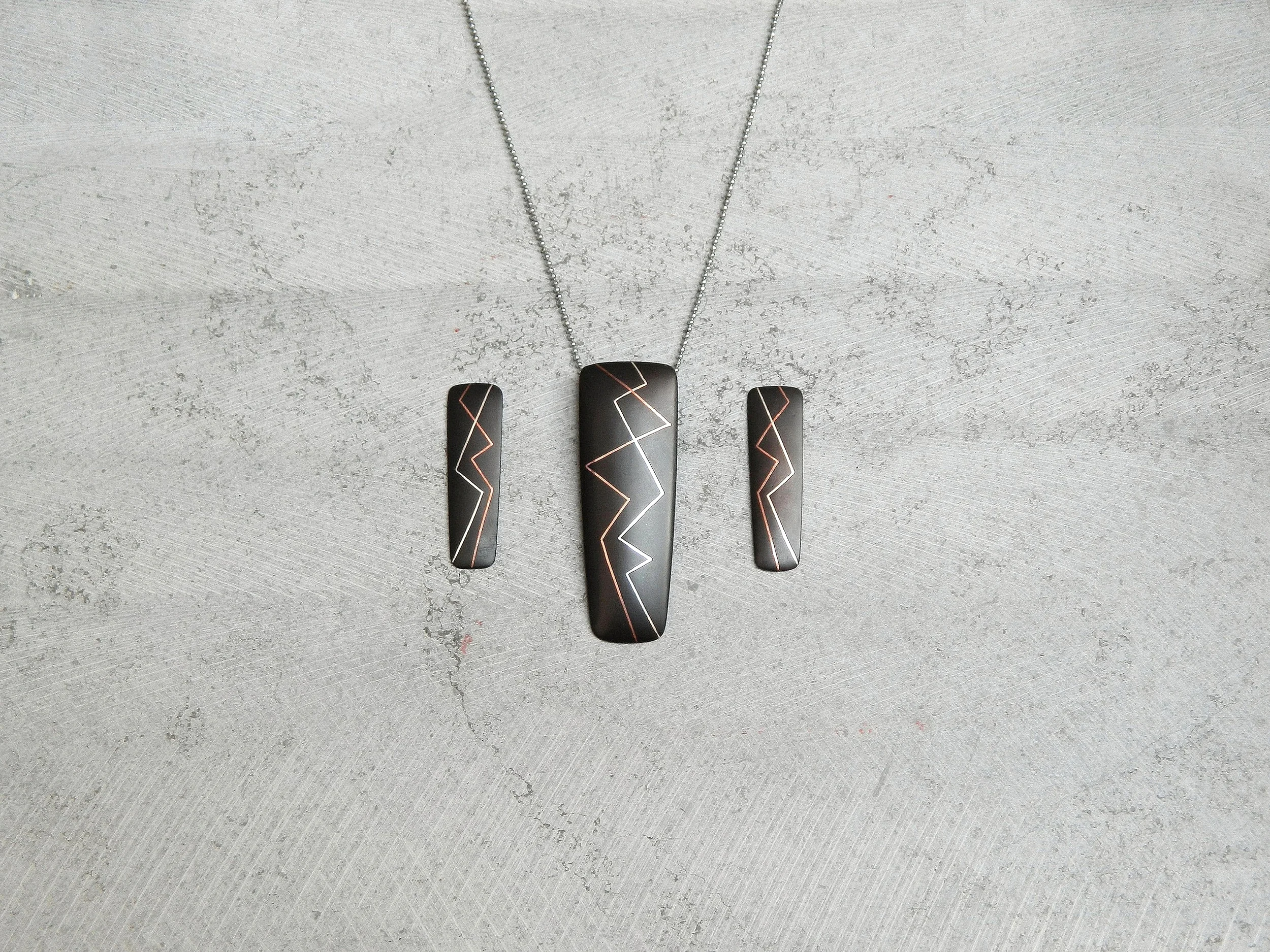   The series is called&nbsp; 'Passion' - &nbsp;It has inlay work of alternating silver and copper lines. They represent the heart beats  &nbsp;of a&nbsp;  couple  &nbsp;. The dynamism of brilliant copper and silver lines&nbsp;  and deep black oxidizi