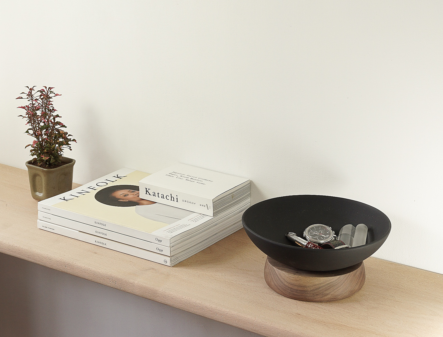 BLUB VIDE POCHE / 2015 BLUB is a set of very soft and minimal versatile bowls. They are made in natural materials like ceramics, wood and cast metals. They can be used as fruit bowls or vide poche. The soft and clean curves of the bowls on top of solid wood create a very complimenting expression. They have three variations in ceramic and cast metal. The wood base comes in walnut and beech. These are screwed to each other for the ease of cleaning and maintenance. The aluminium bowls are sand casted and then blasted with special Swedish Glass beads to get an extremely fine texture and then anodized black or chromatized for magnesium alloy like finish. Size : 285mm x 90mm Materials : Wood base – Walnut /Beech wood. Bowls : Anodized and Chromatized Cast Aluminium.