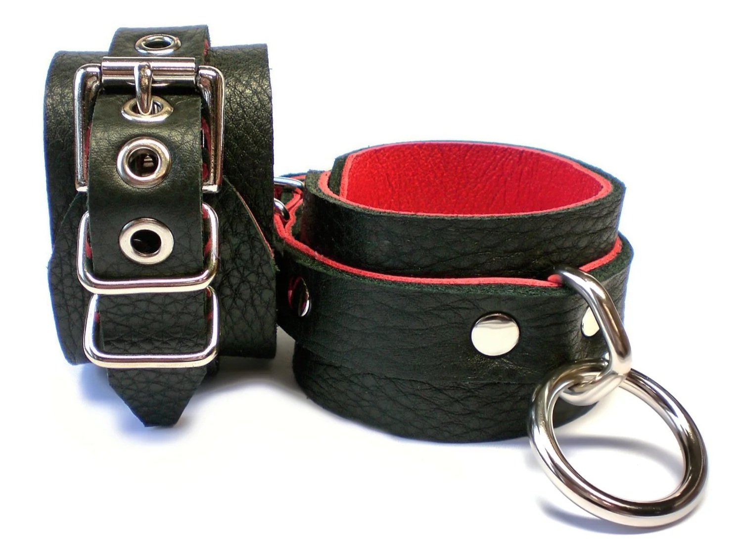 soft black leather restraints with bondage rings lined in red leather