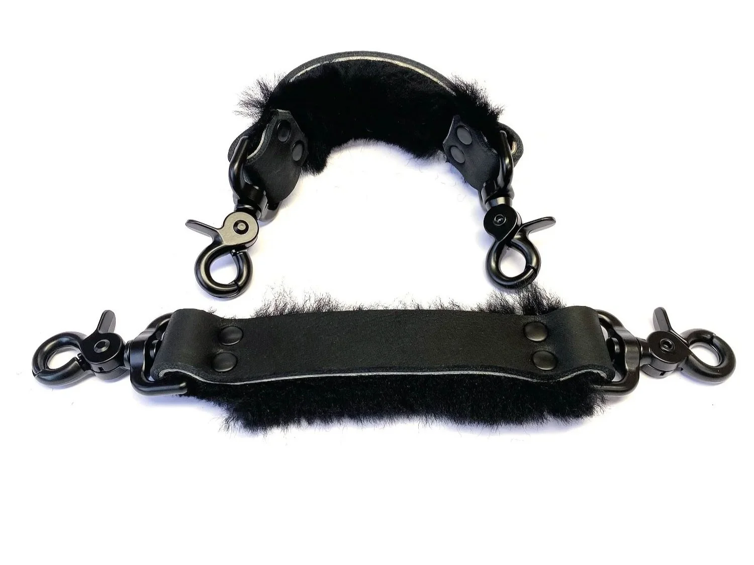 Pair of Black Bullhide Bondage Straps lined in black sheepskin fur with black scissor clips