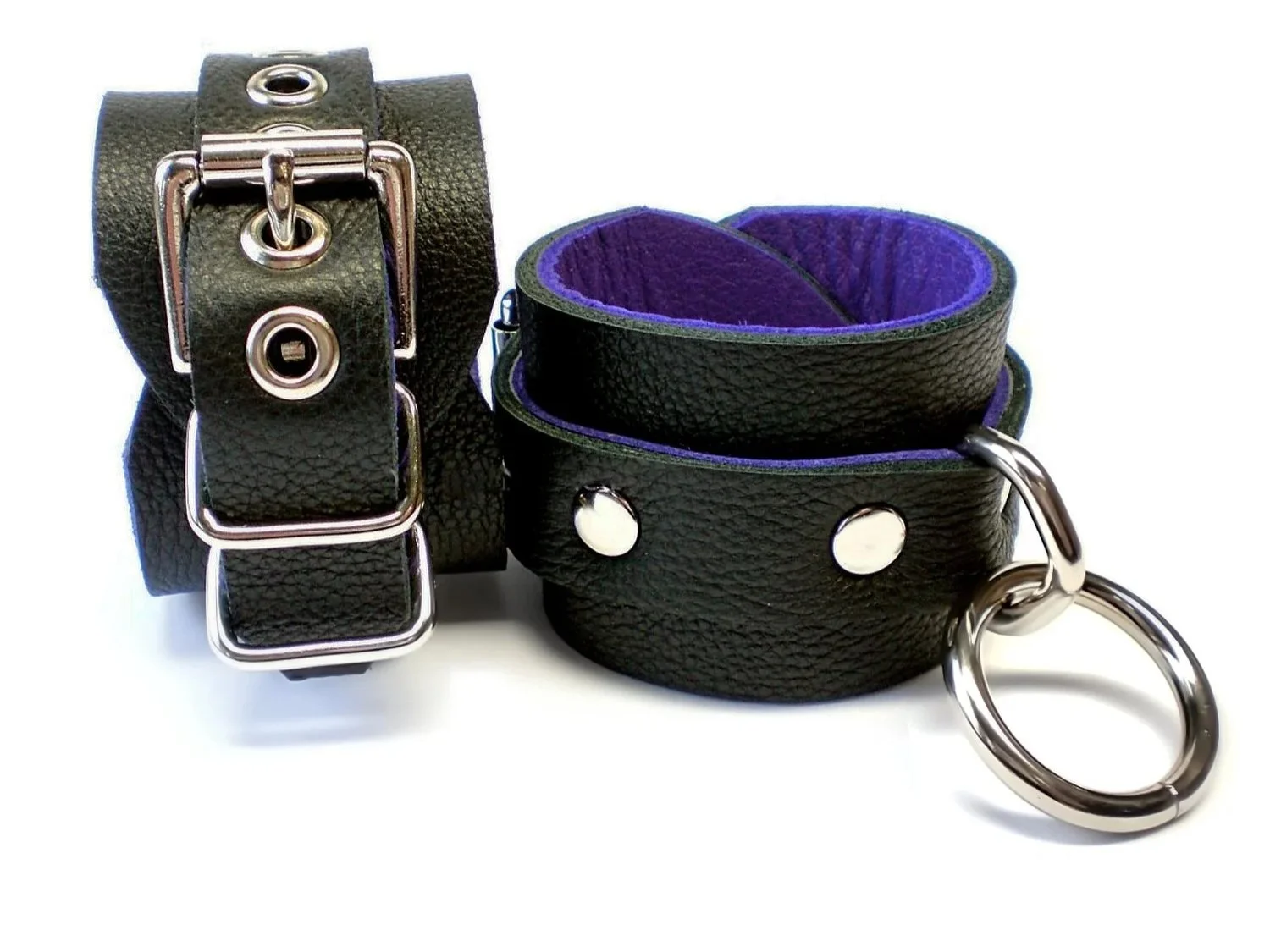 soft black leather restraints with bondage rings lined in purple leather