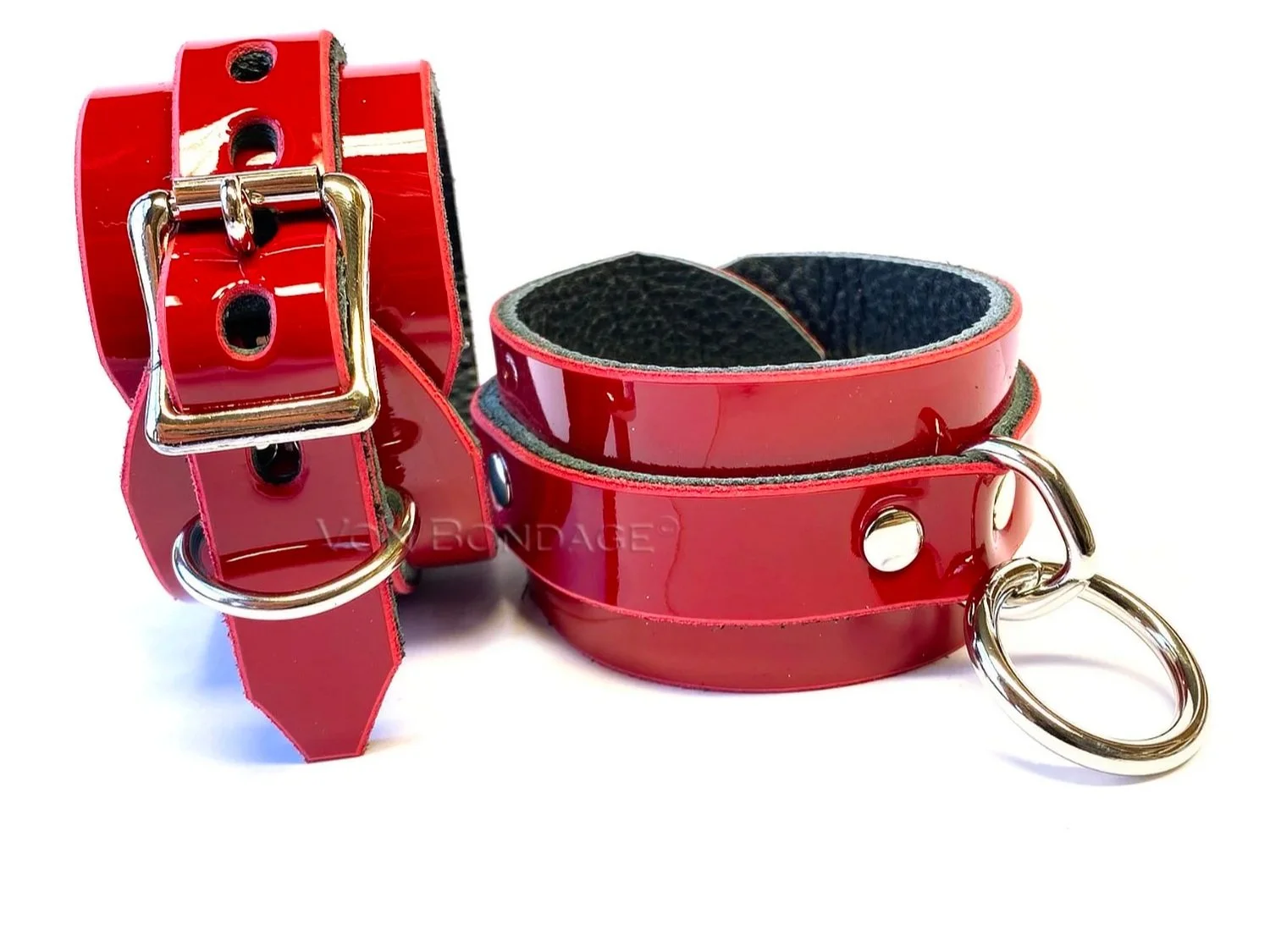 pair of red patent leather restraints for wrists or ankles