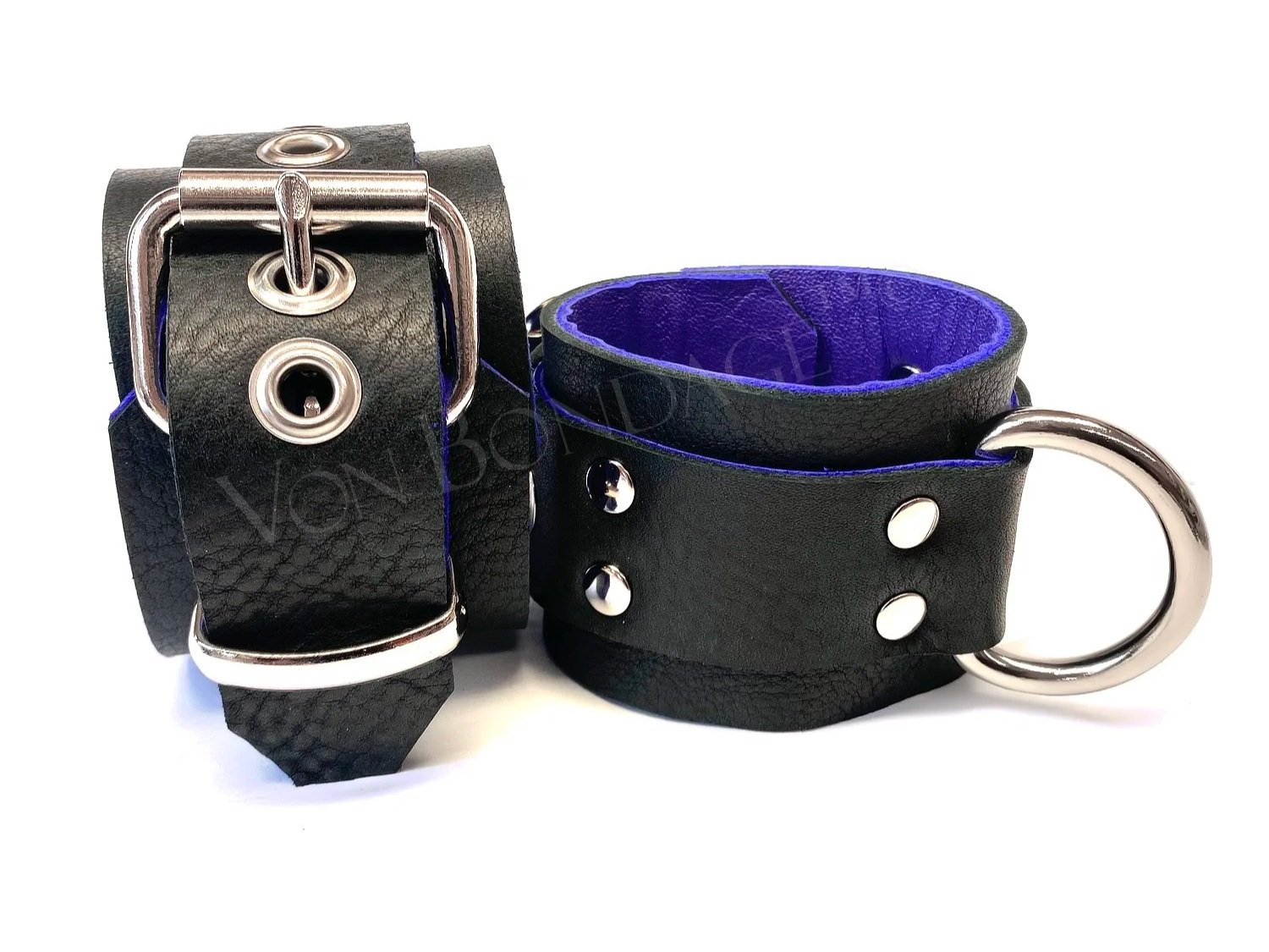 pair of Bondage Restraints lined in purple leather