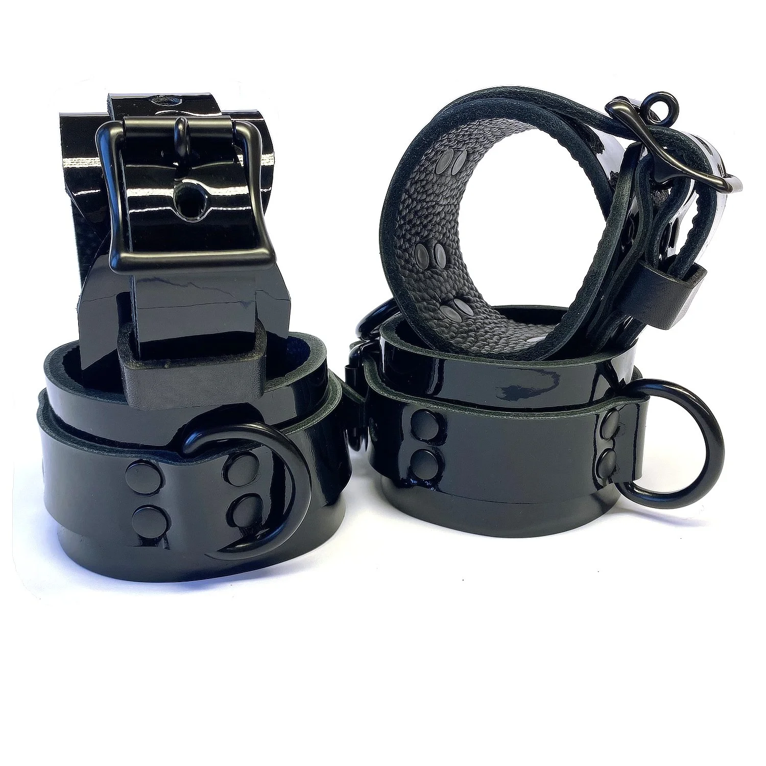 black patent leather wrist and ankle cuffs with black d-rings