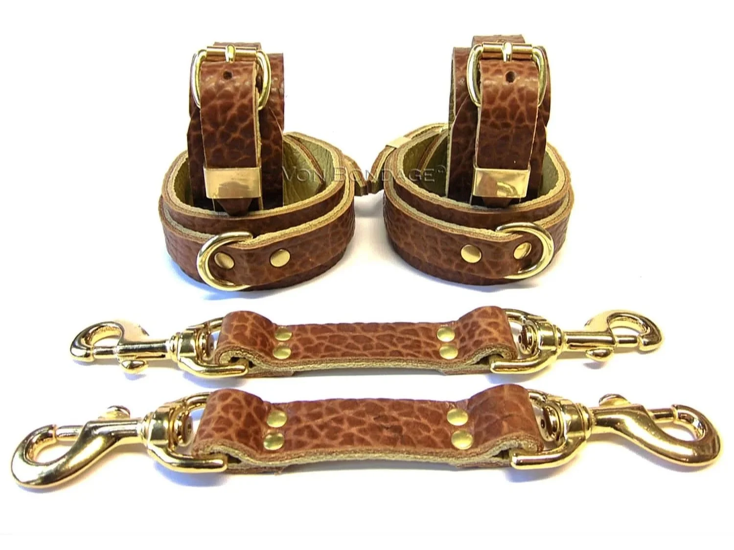 cognac bullhide leather wrist and ankle restraints set with brass dee rings and hogtie straps