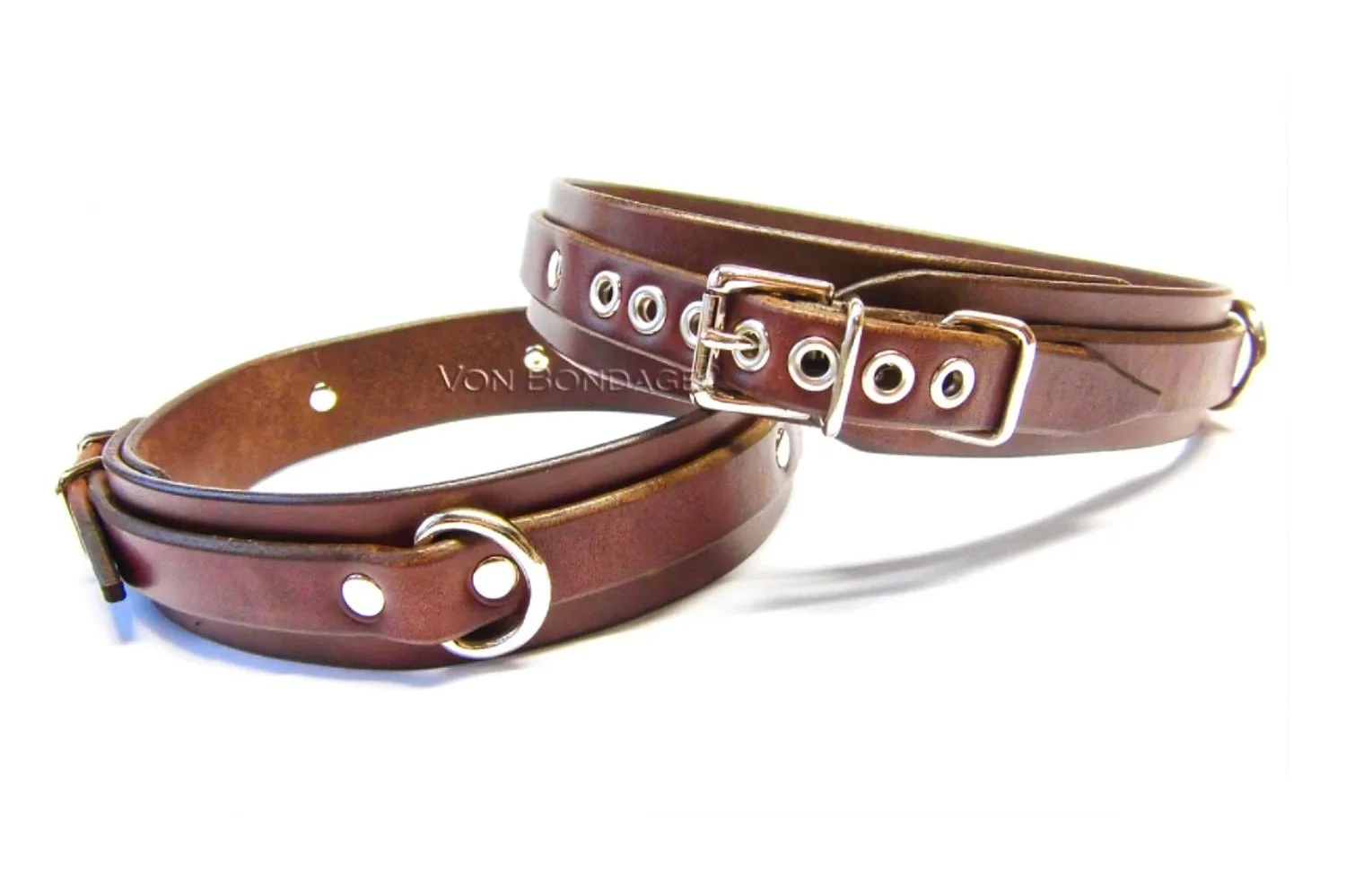 brown leather thigh restraints with d-rings