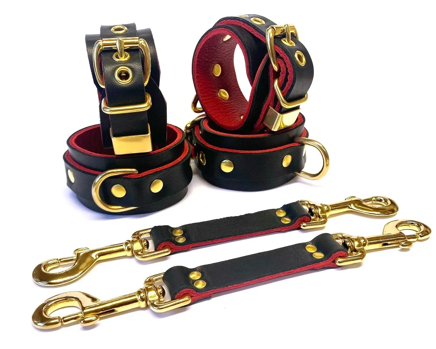 Black & Red Leather wrist and ankle restraints with brass dee rings and bondage straps