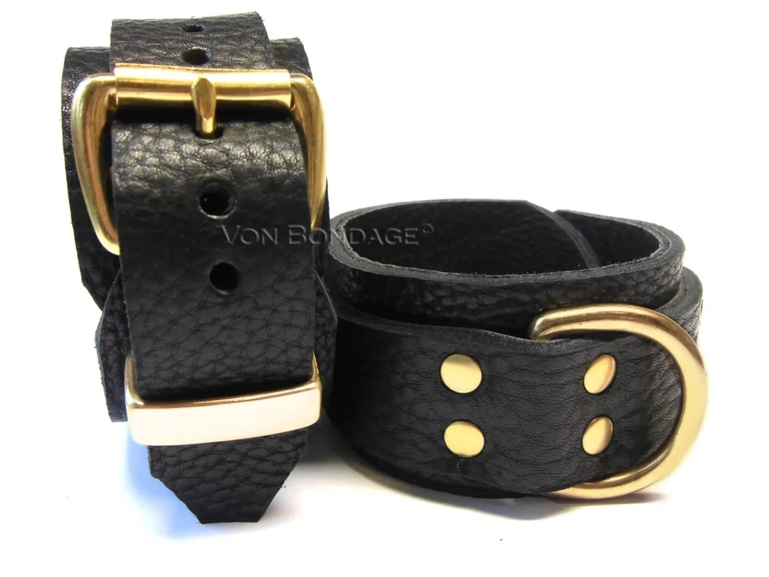 black bullhide with bison leather restraints with large brass dee rings