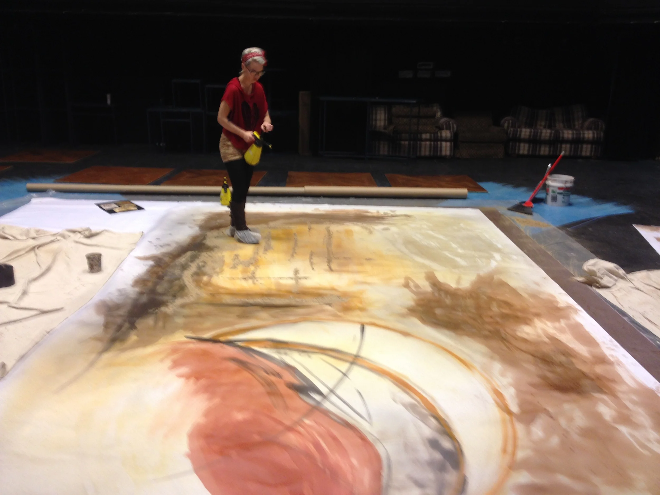  Sarah is spraying a watered down tinted sealer over saw dust to give the drop more depth. 