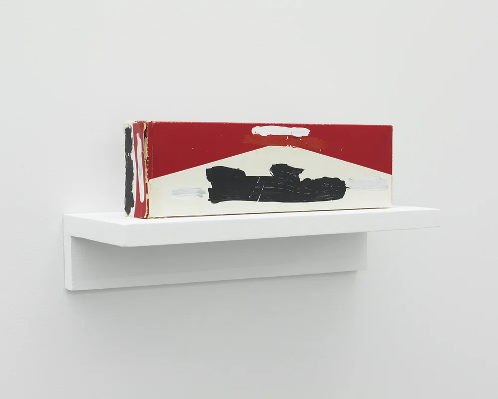 Mark Flood Muted Cigarette Carton 1983 Acrylic on found object 4 x 10 3/4 x 2 inches