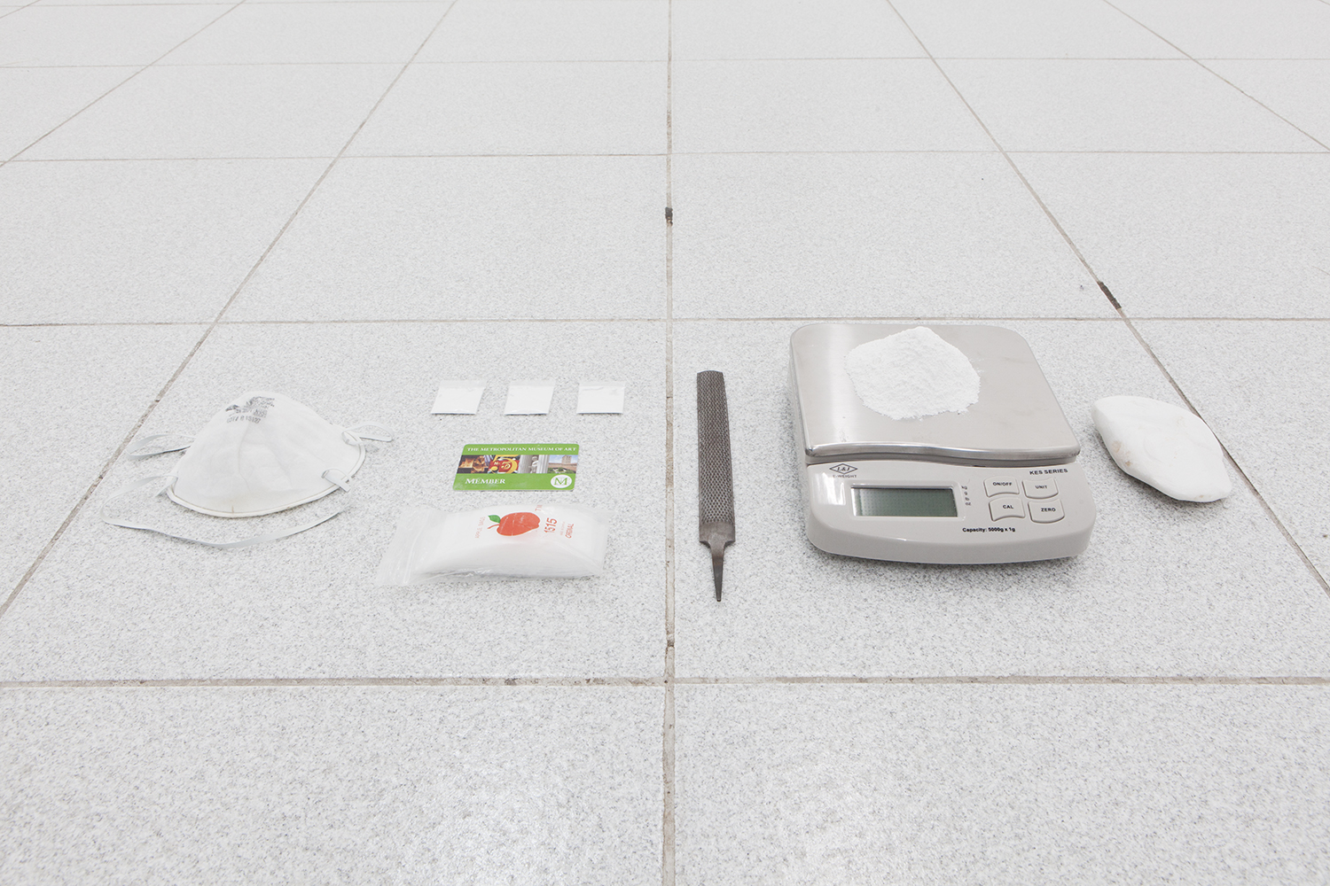 Isaac Brest This Shit Right Here N****?! , 2014 Plastic baggies, dust mask, salvaged marble from parthenon, metal file, salvaged marble from Parthenon filed down to powder, four plastic baggies containing one gram of Parthenon powder and Metropolitan Museum membership card Dimension variable