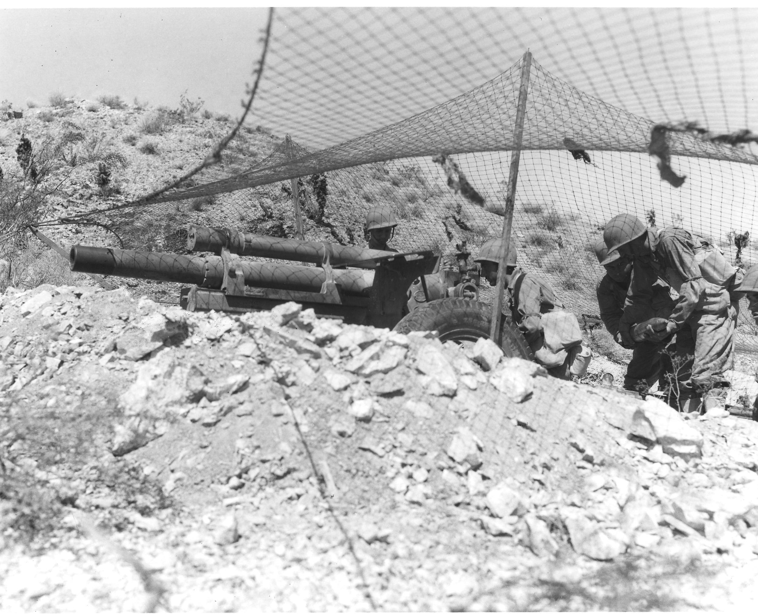 Soldiers practice with field artillery near Needles, California in September 1942. U.S. Army photograph, courtesy of the General Patton Memorial Museum.