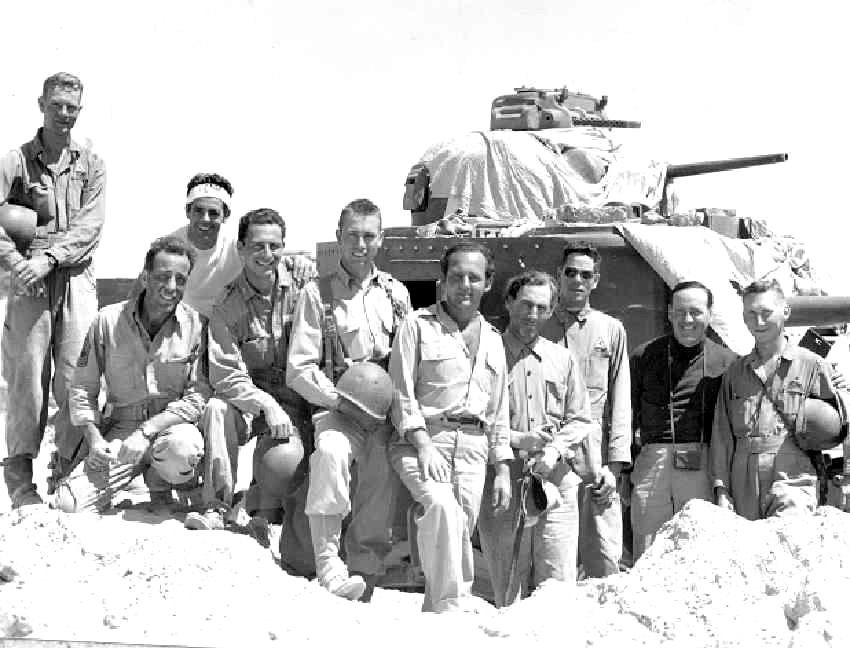 Filmed in and near the Desert Training Center, Sahara not only featured Humphrey Bogart (kneeling at left) but also members of the Fourth Armored Division who trained at the DTC. Courtesy of Eve's Magazine and Kenneth Koyen