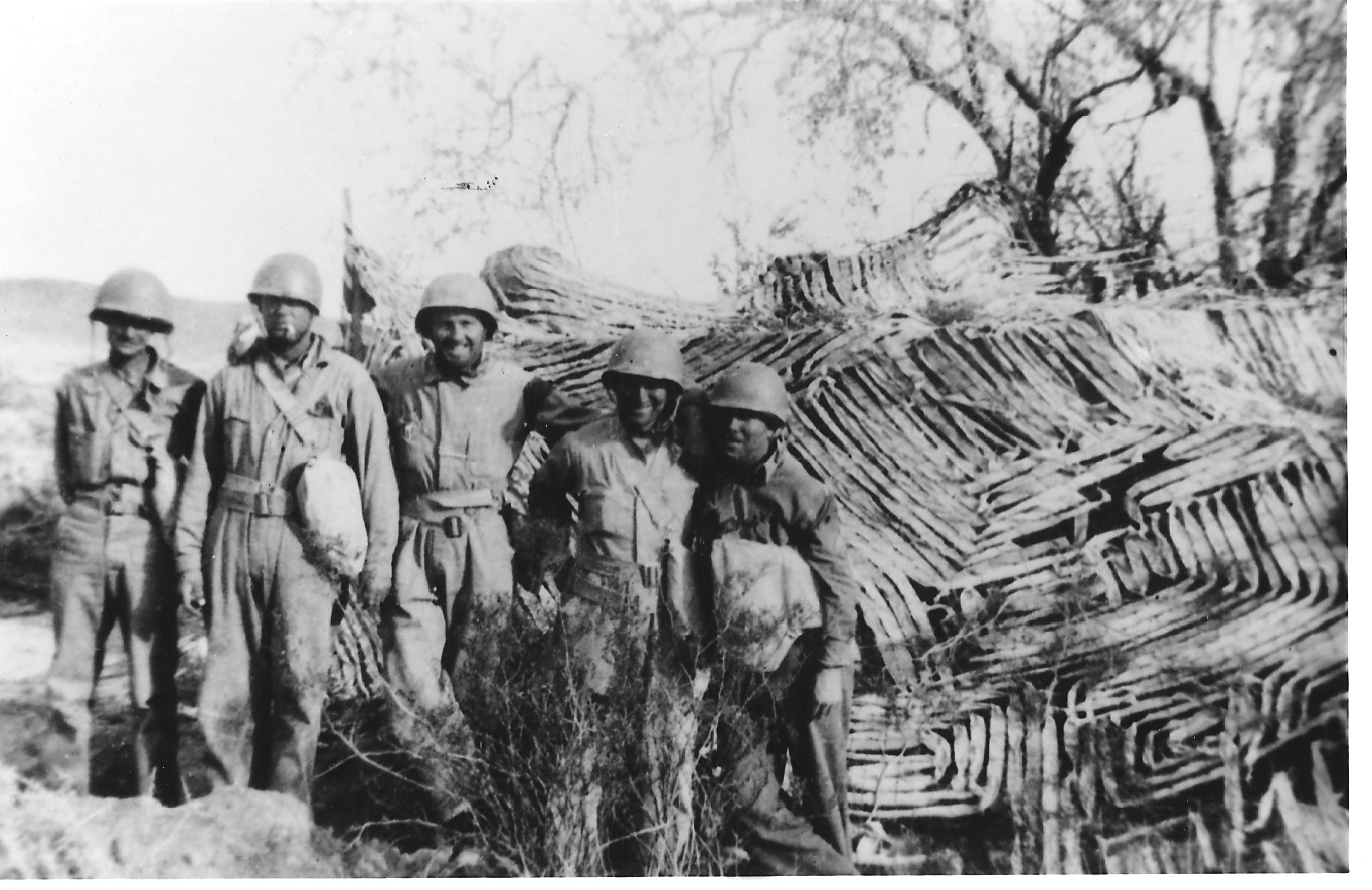 Soldiers pose near a camouflaged tank at the Desert Training Center. Training allowed the army to better understand desert conditions and how to camouflage their equipment and men in sandy landscapes with sparse vegetation. Courtesy of the General Patton Memorial Museum. 