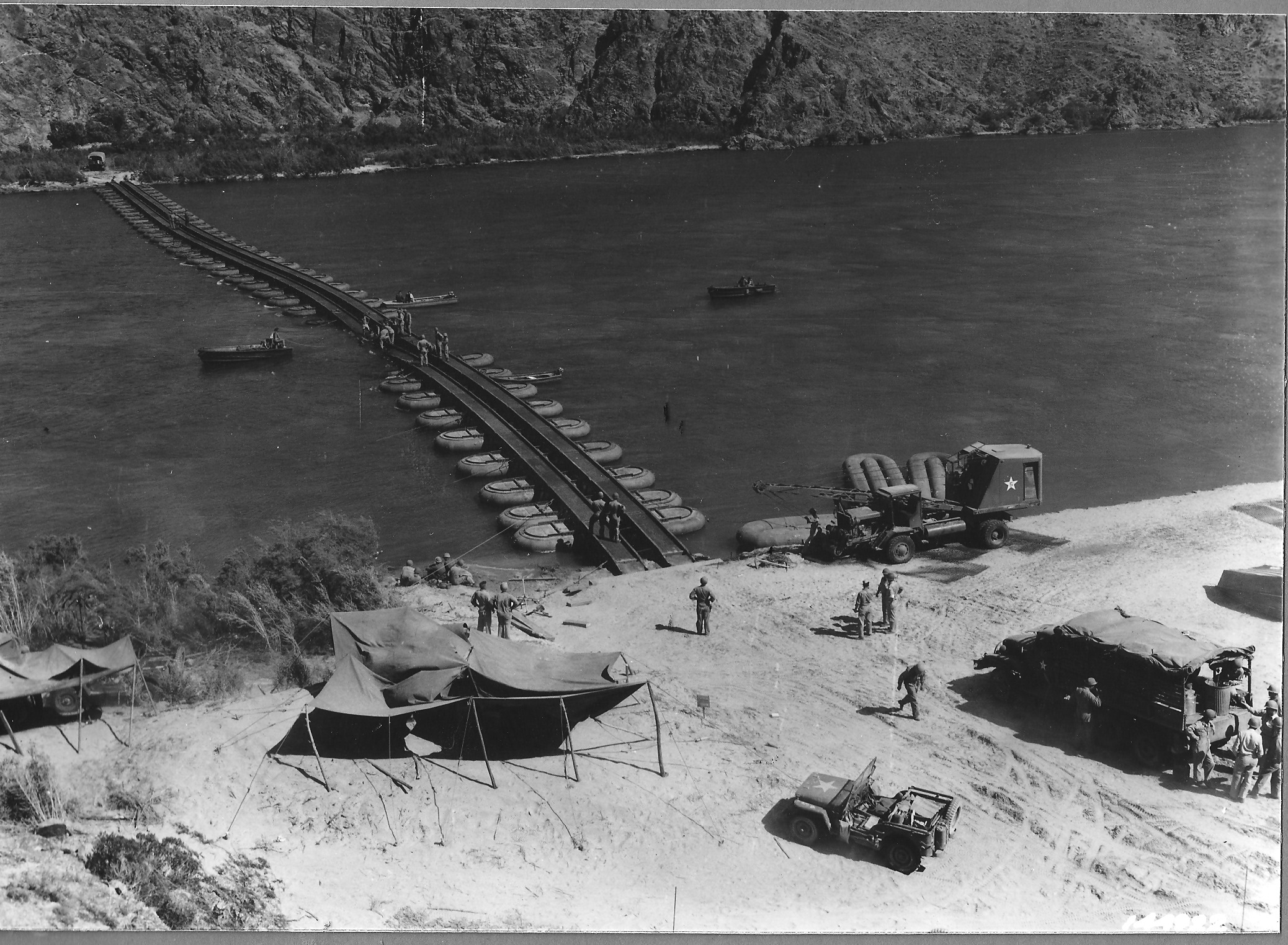 The varied terrain of training grounds allowed for troops to practice their specialty in landscapes similar to those encountered abroad. Here army engineers practice constructing pontoon bridges across the Colorado River. Courtesy of the General Patton Memorial Museum. 