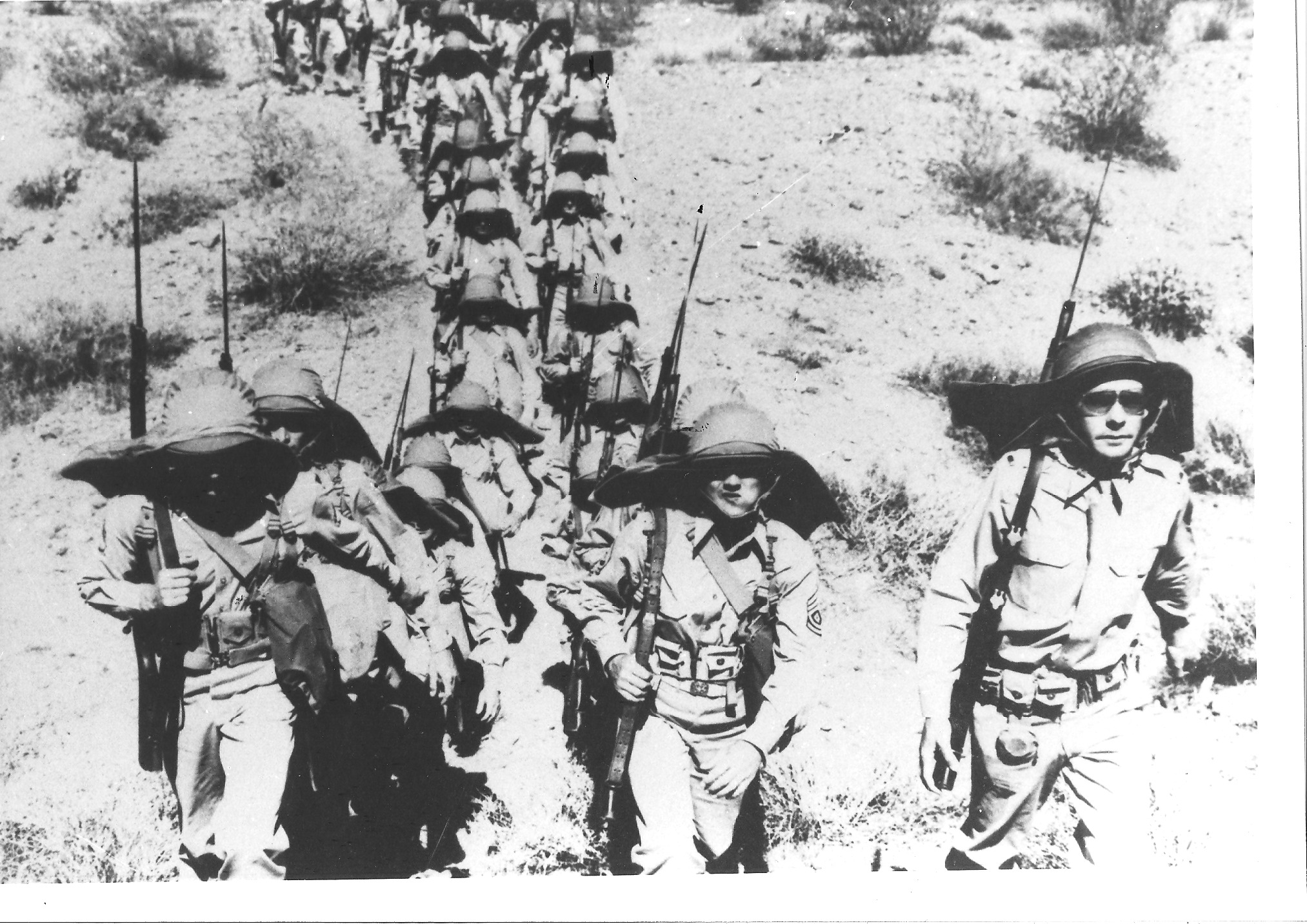 Troops march through the landscapes of the Desert Training Center. Photo by Bill Threatt, courtesy of the General Patton Memorial Museum