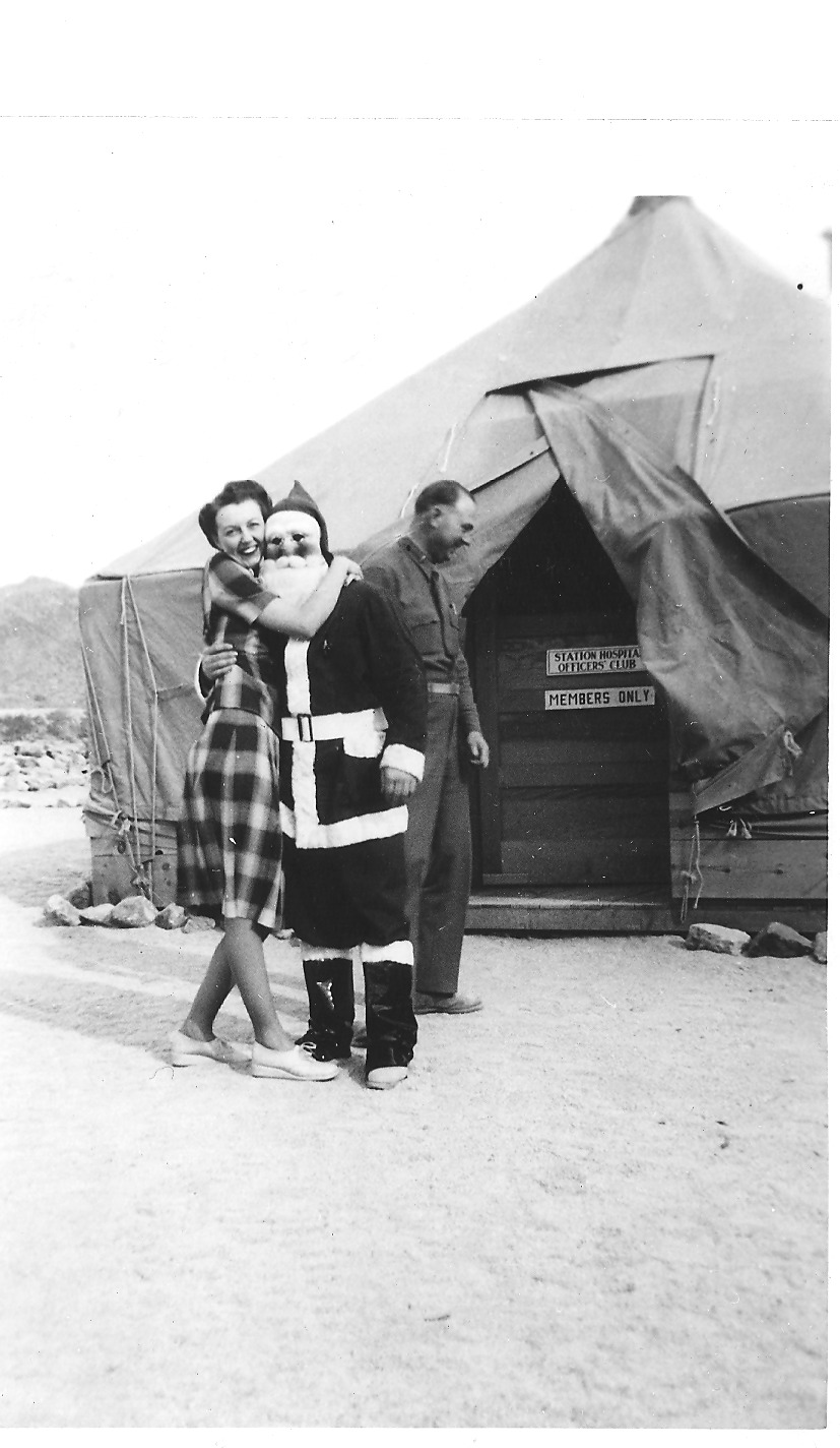 Patton initially refused women at the DTC, preferring that soldiers focus solely on training. Eventually, women worked as nurses and secretaries, especially at the DTC’s Camp Young Headquarters. Here a nurse from the Camp Young Station Hospital poses on the left. To the right a woman hugs Santa outside of the Station Hospital’s Officer’s Club. Courtesy of the General Patton Memorial Museum. 