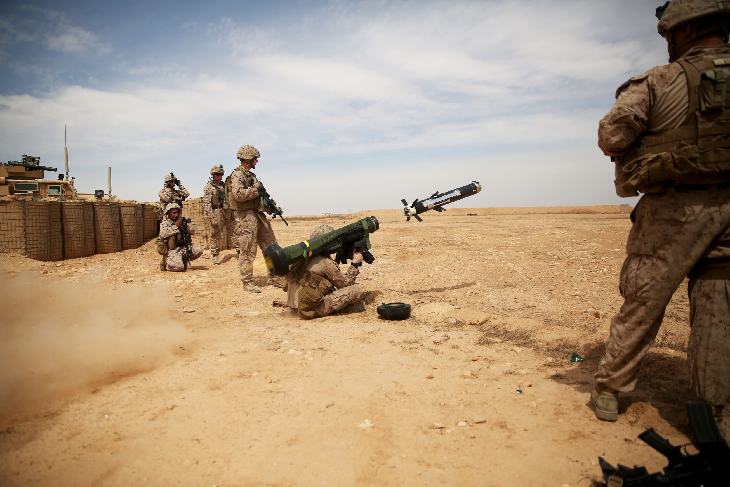 A Marine fires a FGM-148 Javelin missile at simulated enemy armored targets during a combined-arms training exercise at Al Asad Air Base, Iraq, April 3, 2015. | Photo by Cpl. Carson Gramley, United States Marine Corps.