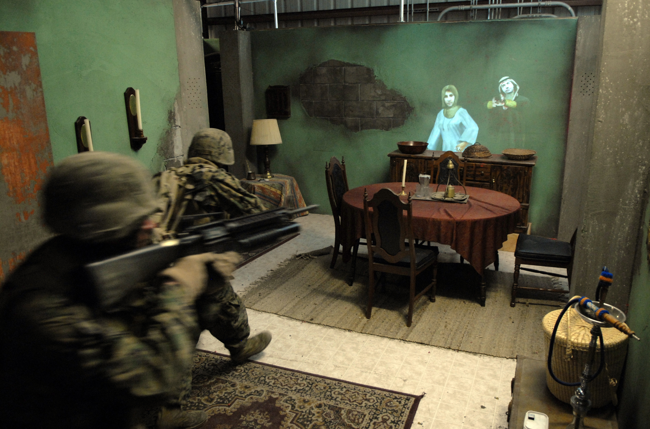 Marines train with projected avatars in live-fire room clearing training at the Battle Simulation Center at Marine Corps Base Camp Pendleton, CA. | Photo by John F. Williams, United States Navy.
