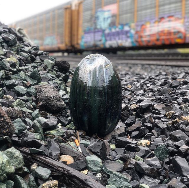 Rainy May Saturday. Caught the train coming by. This one is called: scrap.scales.equal. 
#concretejungle #egg #streetart #ceramics #pottery #eastbay #find #finderskeepers #trains