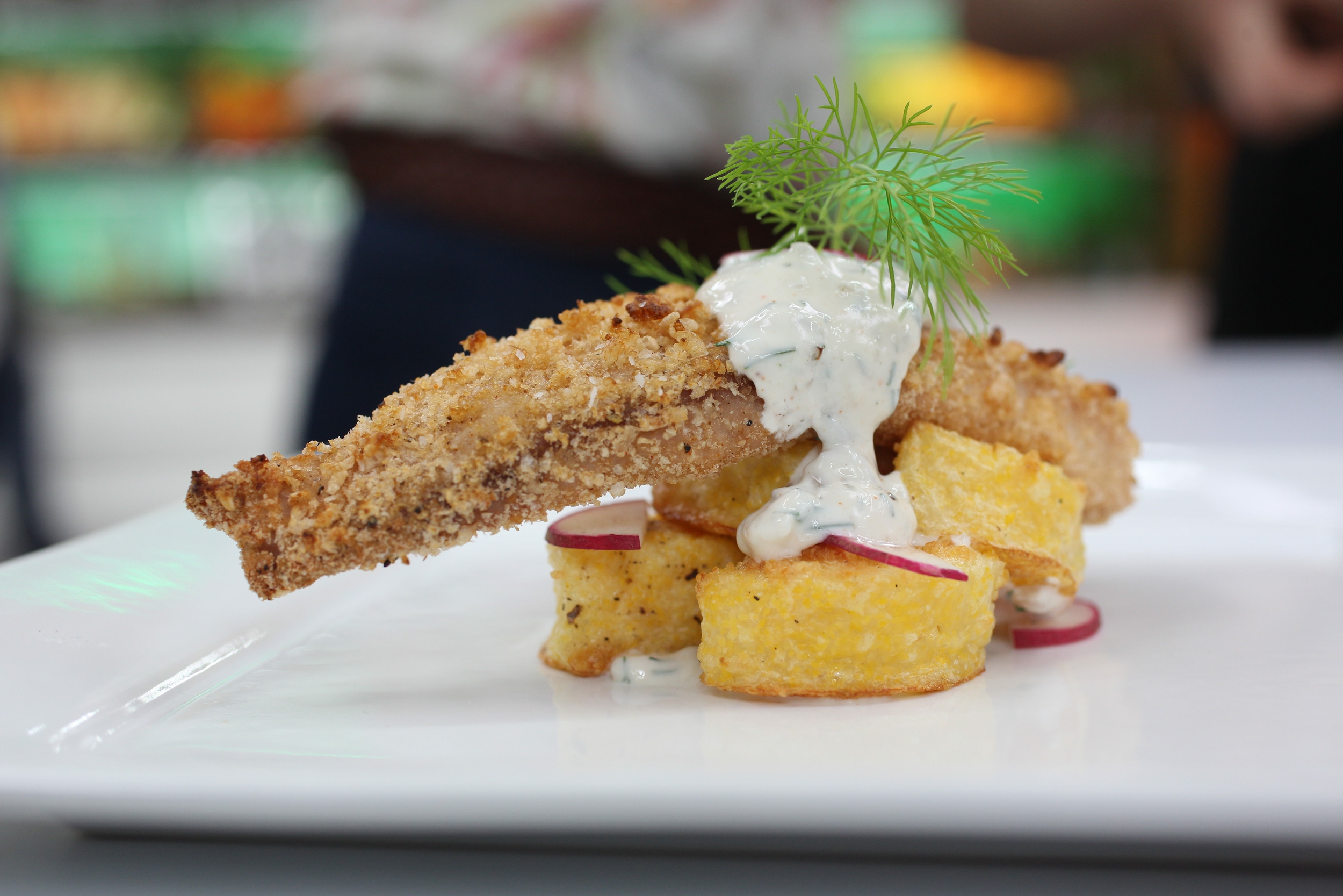 Tots served with baked crusted fish. You can find the full recipe here . Photo by Vanessa Stump .