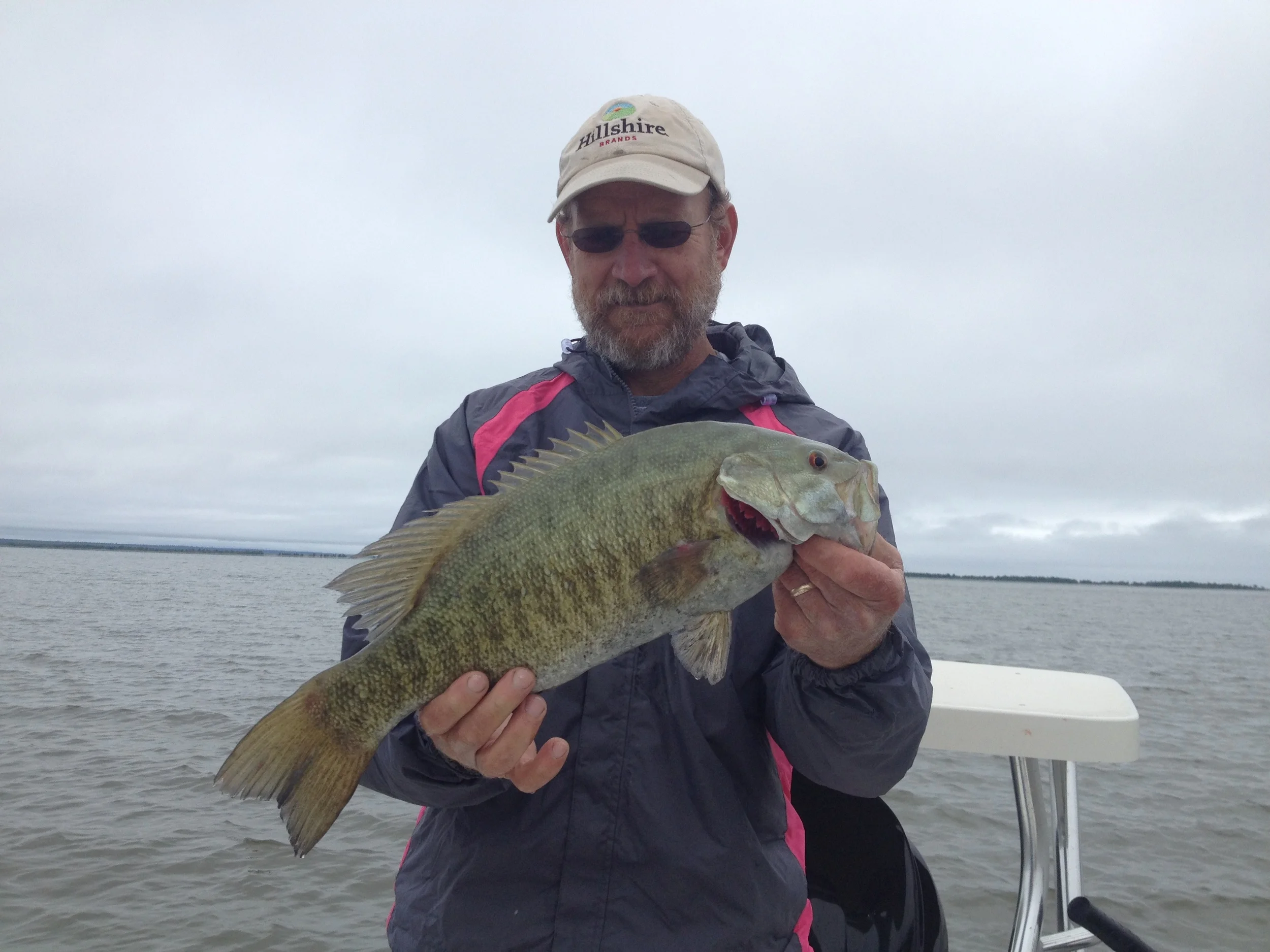 Chuck with yet another great fish. That sea green color and those dark stripes along with those bright red eyes never get old to look at!
