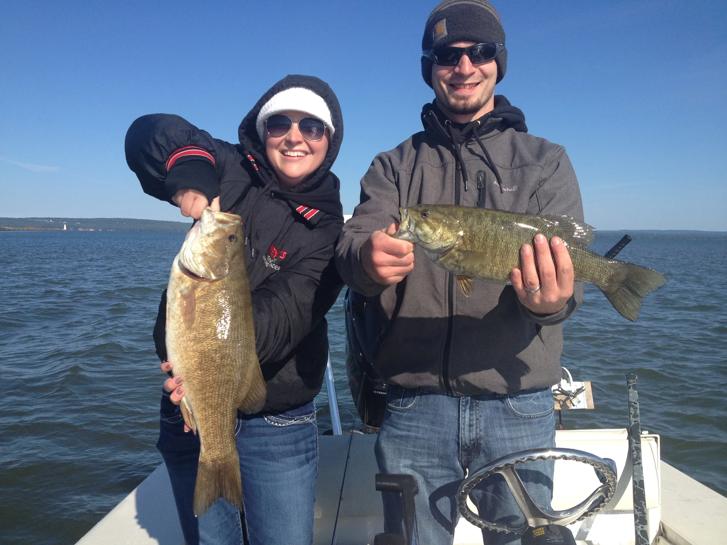 Ashley and Dan came up to Ashland to celebrate their 1st wedding anniversary and had a great day out on Chequamegon Bay. Sorry Dan, but I think Ashley's fish was a little bigger.....