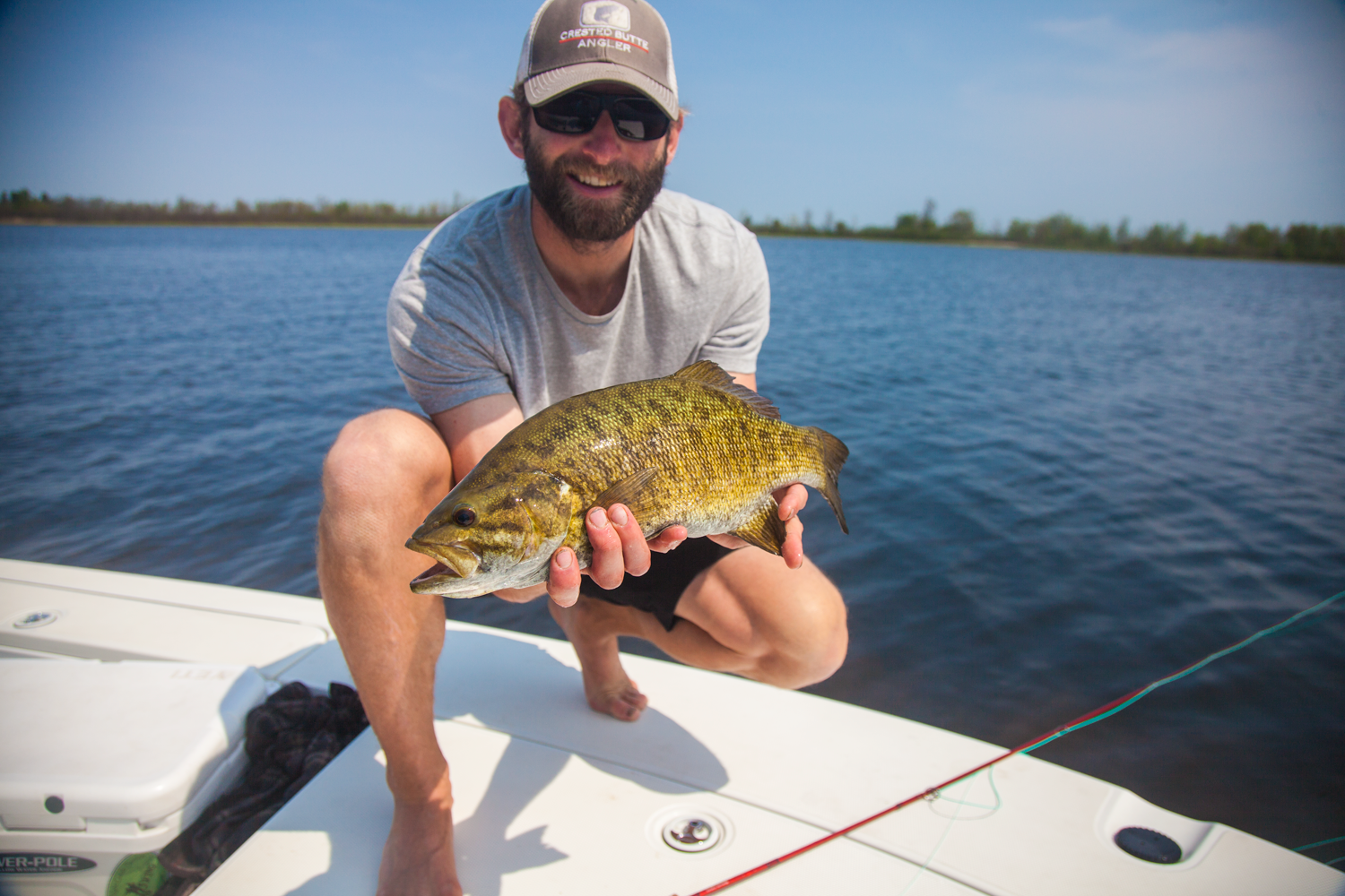 Rob from Crested Butte, Colorado with a great fly rod smallmouth. Many different techniques are working for both fly fishing and light tackle angling.