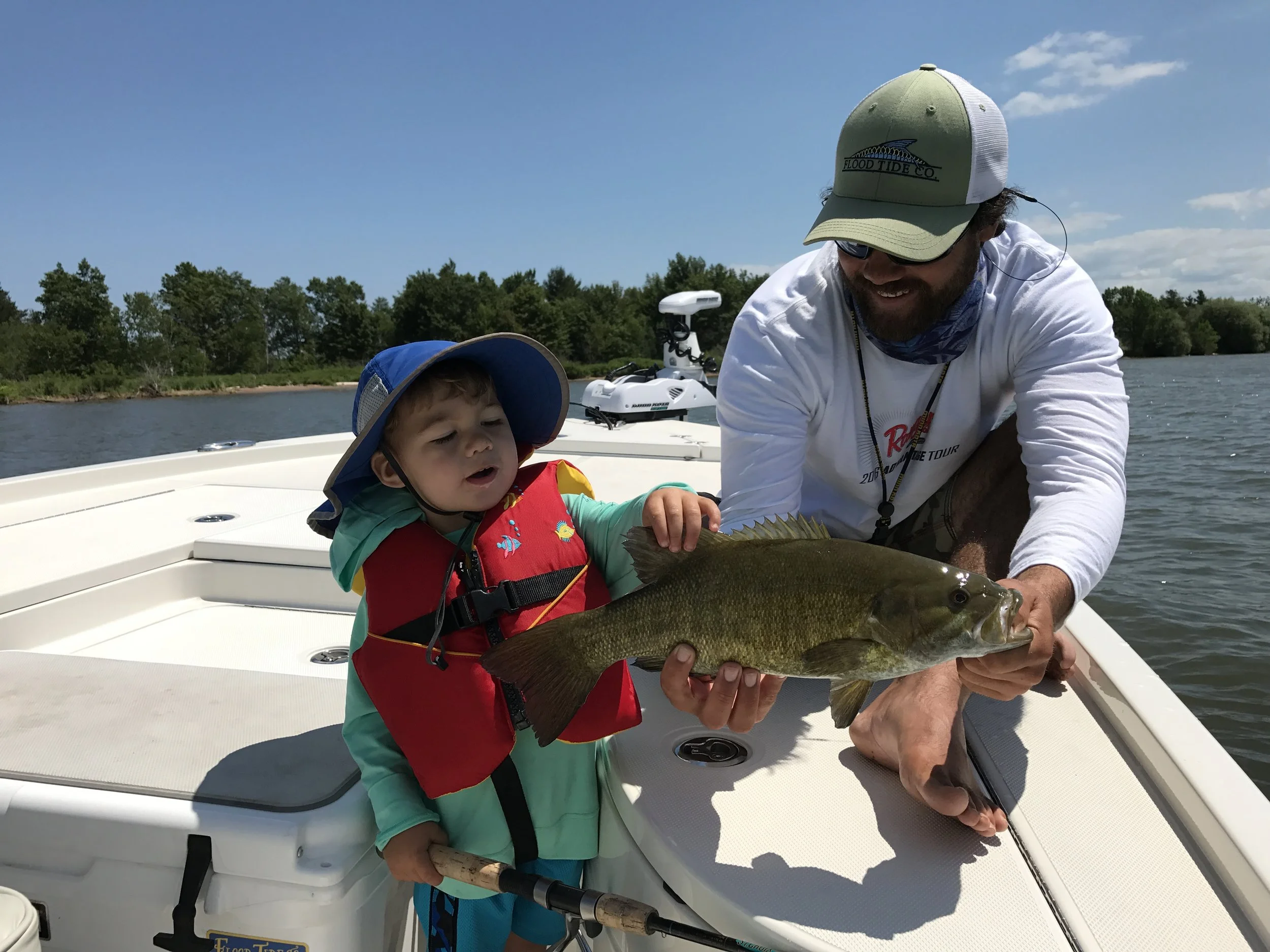 Capt. Luke and his son Jay with a Bay smallmouth
