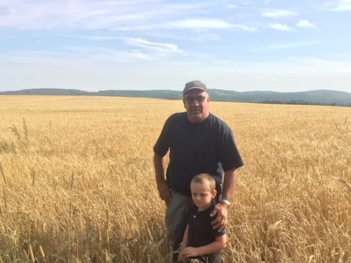 Pictured: Wayne Marquis, Owner (with Grandson)