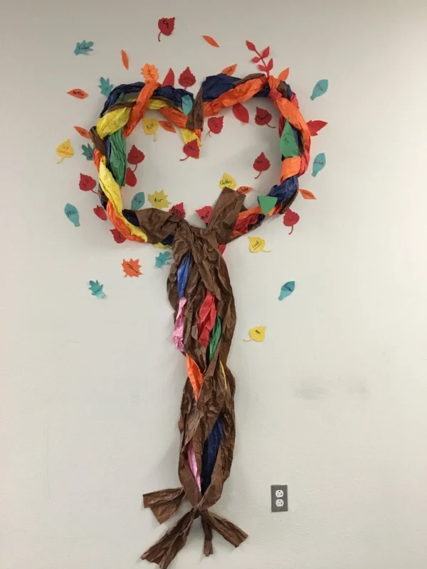 This tree represents the roots of our beginnings, the diversity of us all, and the love that conquers all.