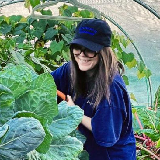 melissa geurts gardening in her greenhouse