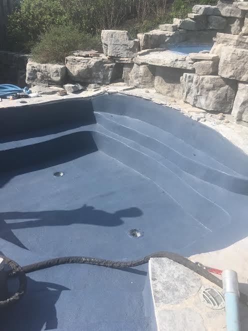 concrete spa after wearing Mediterranean blue ecofinish