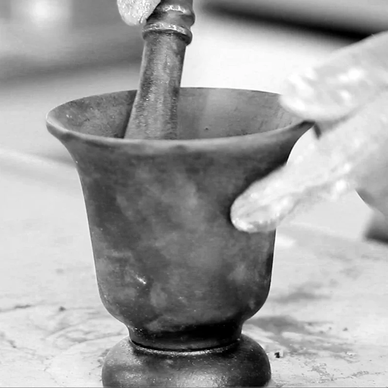 Iron mortar and pestle.