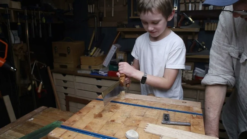 August sawing the box joints on the chopping block