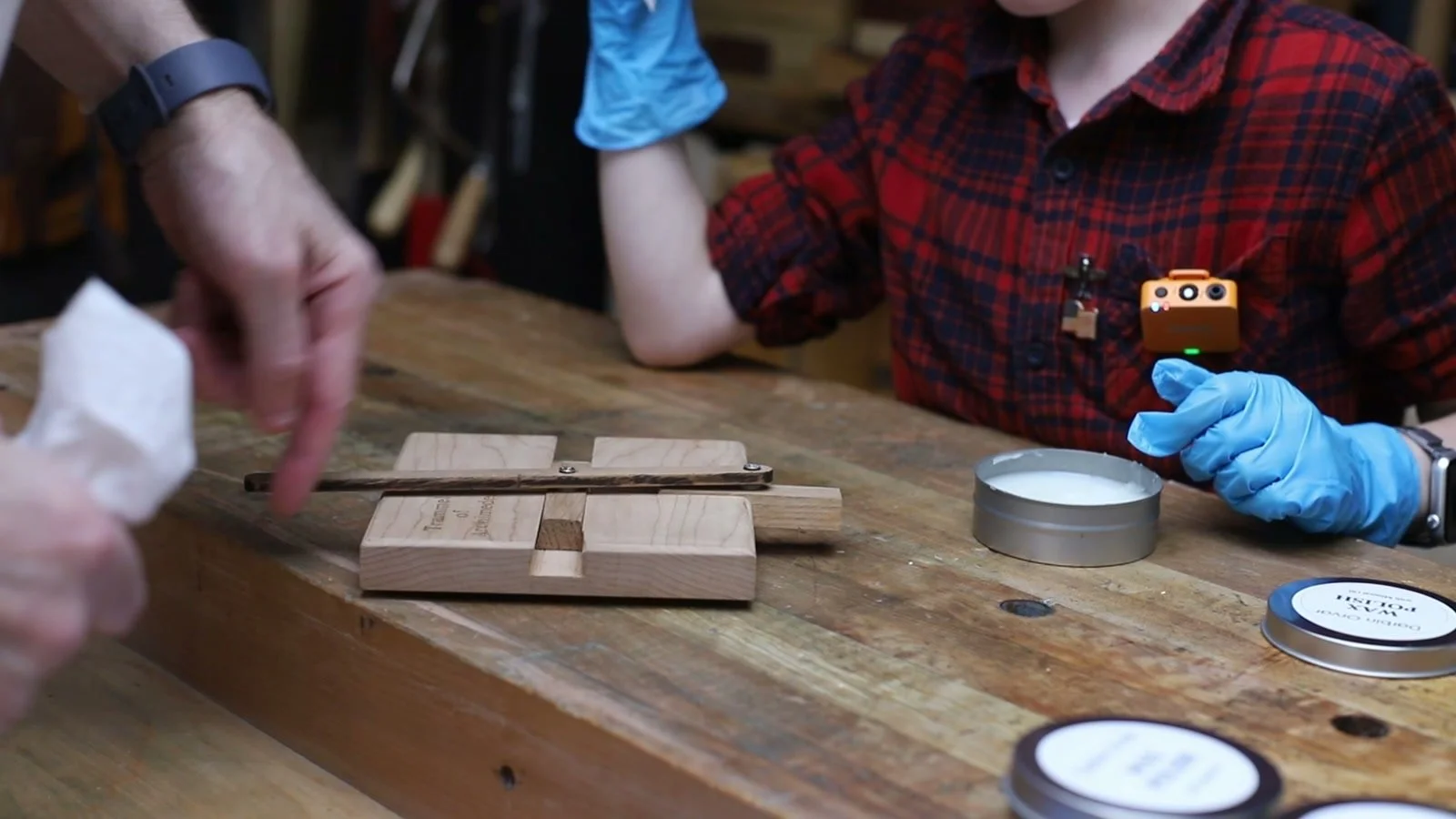 Waxing the sliding tracks of a wooden trammel of Archimedes