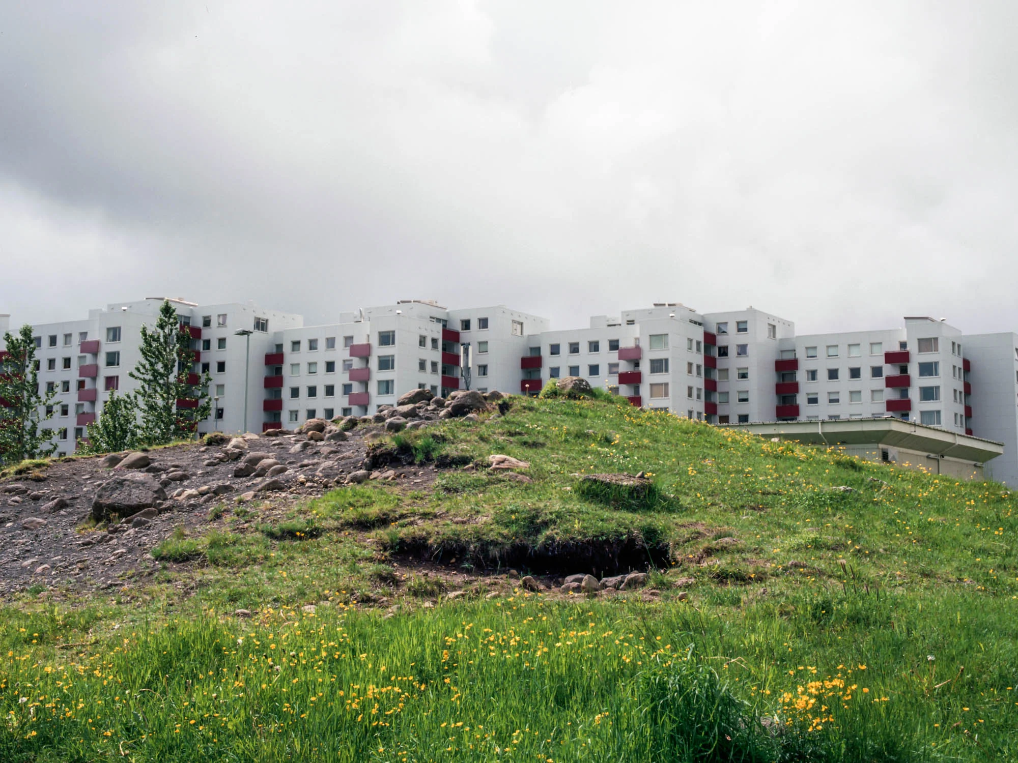 Álfhóll, Vesturberg Breiðholti. In the 70´s, plans to build a block of flats in the Breiðholt area where changed to spare an elf-hill on the location. The block was eventually built behind the hill, rather than levelling it.