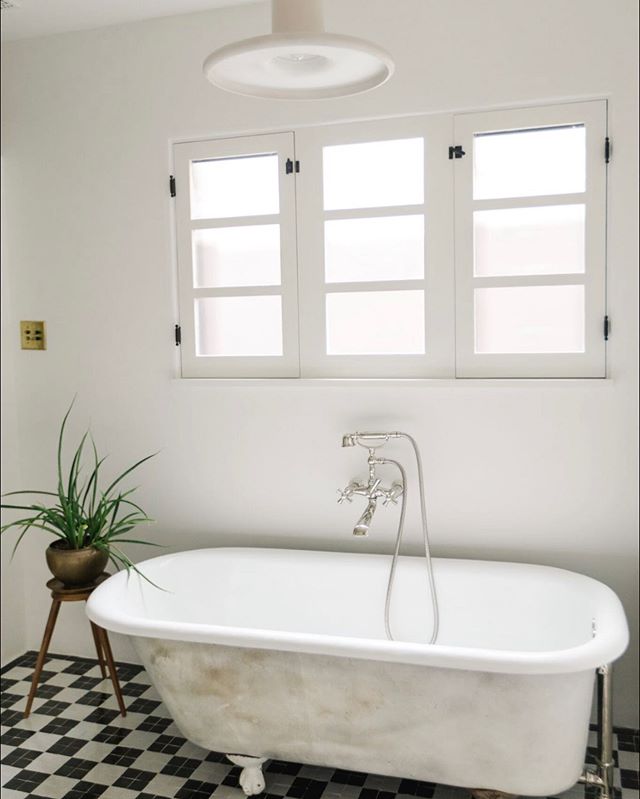 The blending of 1920s charm, 1970s clean lines and North African earthiness was a fun challenge. We chose to keep the original patina on the exterior of the vintage cast iron tub rather than re-glazing. As we design, we attempt to maintain true chara