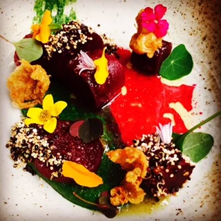 pastrami-cured beets, chicken skin, puffed grains, fines herbes, burnt orange