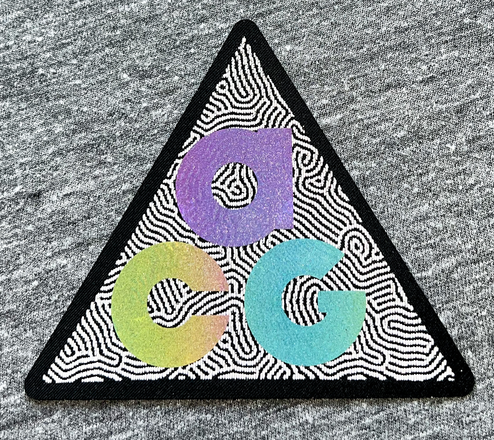  The bright rainbow reflective overshadows the reflective thread of the pattern behind it but creates a beautiful effect. 