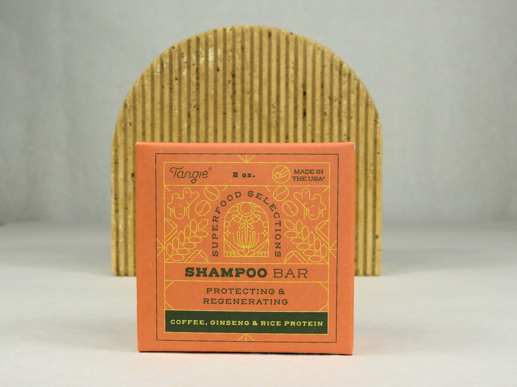 Tangie Superfoods shampoo bar with arch background.png