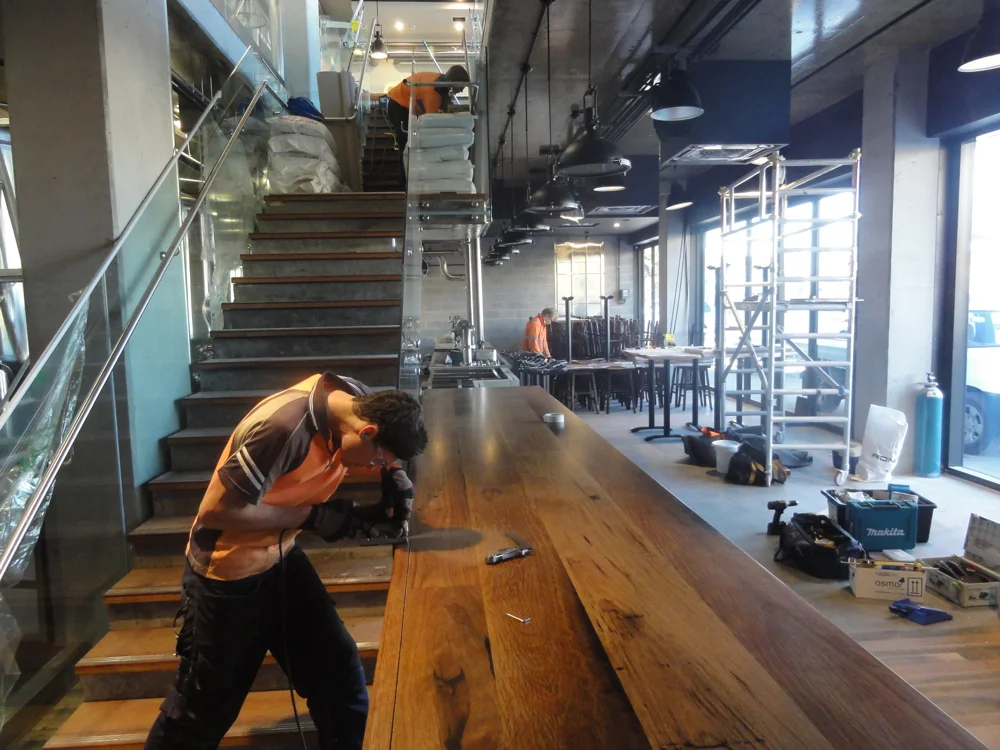 Sam cutting in the 5 meter bar top during install